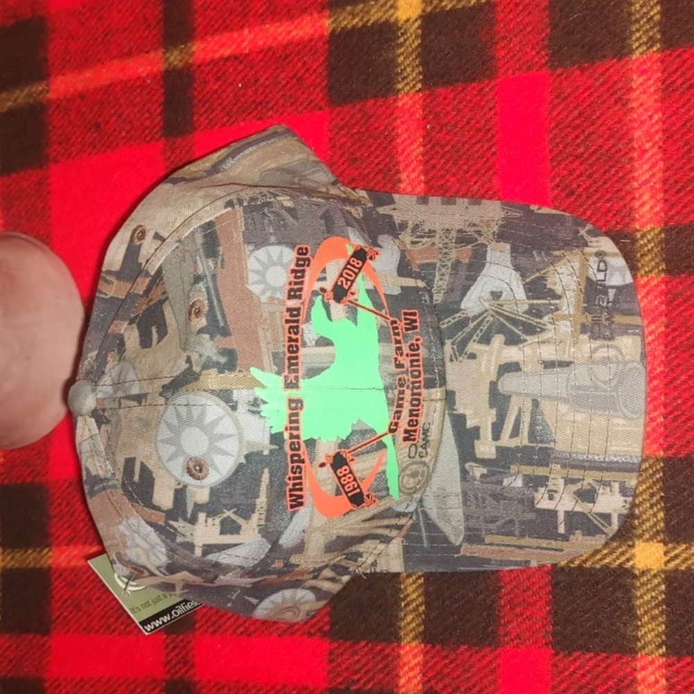 Whispering Emerald Ridge Game Farm Menomonie, WI Oilfield Camo Strap-on Cap New